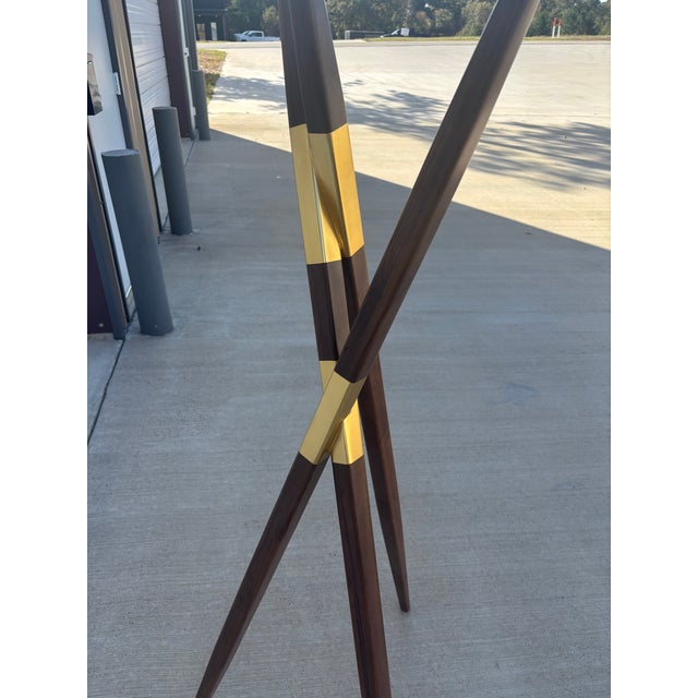 the perfect modern accent for a refined, design-forward home. Its slender, sculptural silhouette and smooth, warm brown...