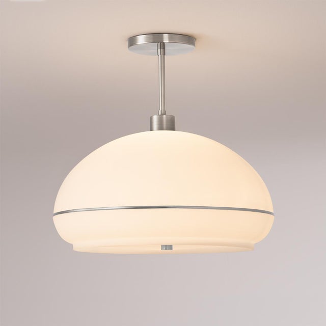 The Morelli Semi Flush Mount is a sophisticated lighting solution featuring a Satin Nickel steel frame and a striking...