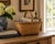 A beautifully woven early 20th century American splint oak basket with warm honeyed tones and a tightly constructed...