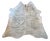 Oversized natural Brazilian hair-on cowhide rug featuring the distinct brindle striping concentrated along the backbone...