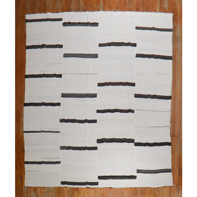 a 3rd quarter of the 20th Century Vintage Turkish Wool Kilim in white and dark brown Details rug no. j2434 size 10' x 12'...