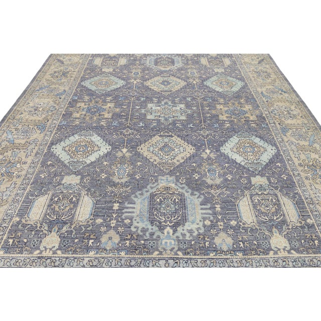 Elevate your space with this stunning Modern Tabriz style rug, meticulously hand-knotted using a luxurious blend of...