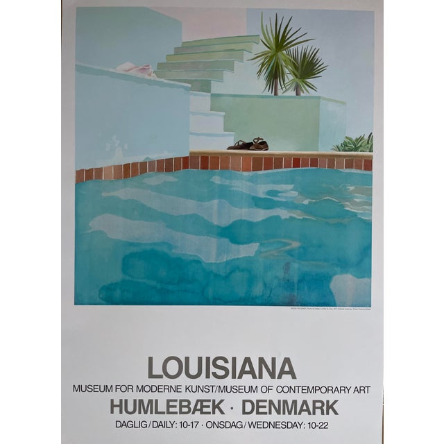 Elevate your space with this striking Louisiana exhibition poster featuring Pool and Steps (1971) by David Hockney...