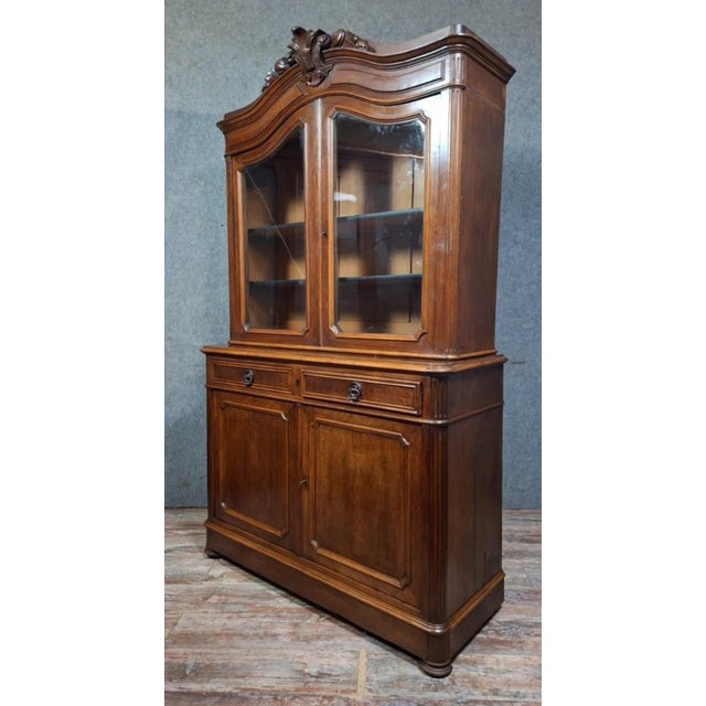 Two-part Napoleon III period solid wood buffet. Elegant two-part solid wood buffet, the upper section opens with two...