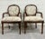 This is a stunning pair of vintage French Louis XVI style arm chairs or Bergere chairs with beautiful carvings by...