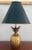Petite brass pineapple lamp with black tole metal shade than has a gold interior. Small lamps are always so useful. Solid...