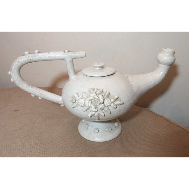Up for sale is a very nice quality antique hand sculpted Italian pottery pitcher. It's made of thick white painted pottery...