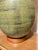 This is a pair of large Mid-Century pottery lamps. The striated green glazes are truly gorgeous. The base and accent at...