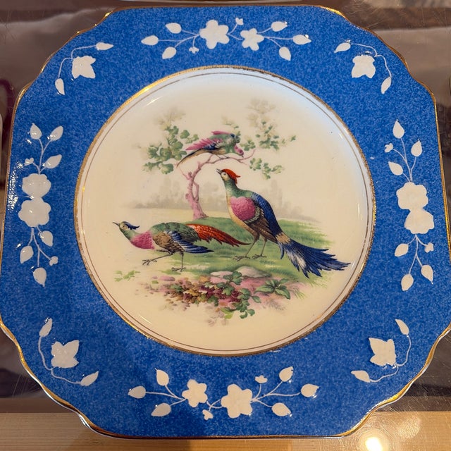 Gorgeous set of seven Wedgewood queens ivory pheasant plates. Two pink, two green, two blue and one yellow.