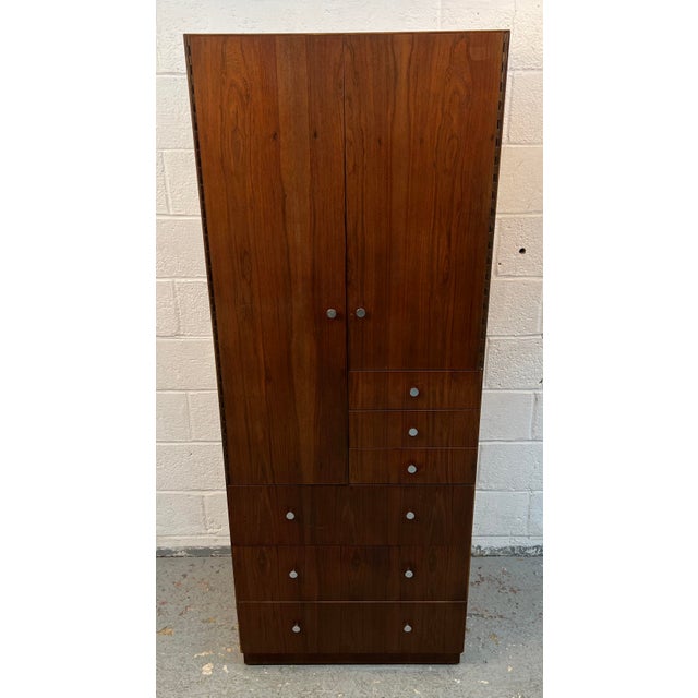 Striking Mid-Century Modern walnut and chrome armoire dresser by Directional. A perfect blend of timeless design and...