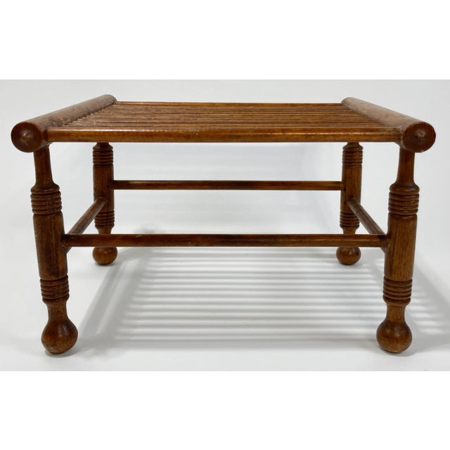 Unique vintage turned wood riser or plant stand. Features wonderfully detailed legs with stretchers supporting a slatted...