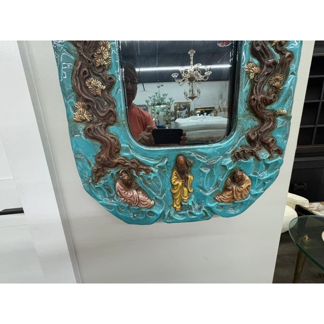 Italian Ceramic Mirror. Offered is a beautifully detailed Italian Hollywood Regency mirror from the 1960's. This shapely...