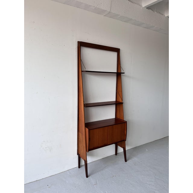 Original condition—appropriate for its age. There is a visible mark on one shelf.