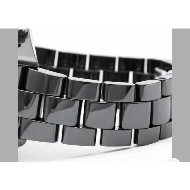 Chanel, Paris, J12 Automatic 200M. Black dial enhanced by luminous hands. Black ceramic case with a black ceramic band....