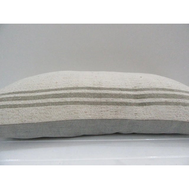 This is a pillow cover made from a vintage kilim rug. The piece was properly washed and ready to use. Pillow inserts not...