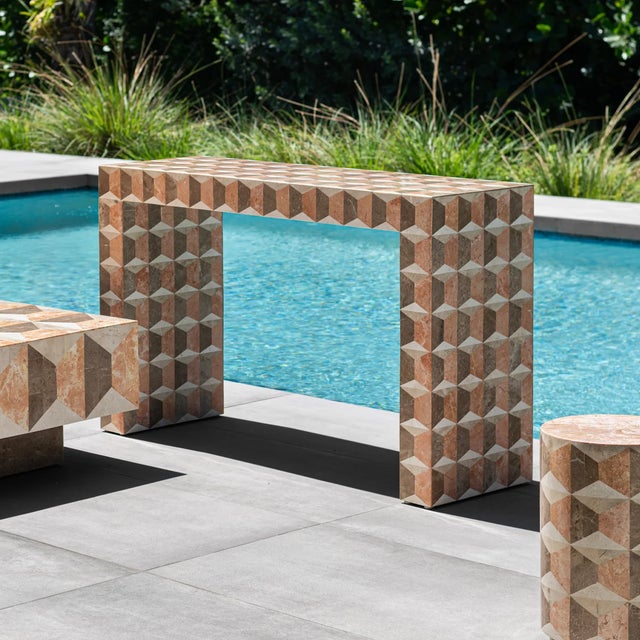 Inspired by the graphic patterns of Fornasetti, the Milano console presents a striking architectural silhouette. Skilled...