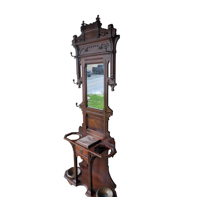 An authentic late 19th-century Victorian Eastlake hall stand featuring the movement’s signature geometric millwork,...
