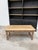 This antique coffee table has been completely restored. It features a small, functional drawer and a carved wooden base. I...