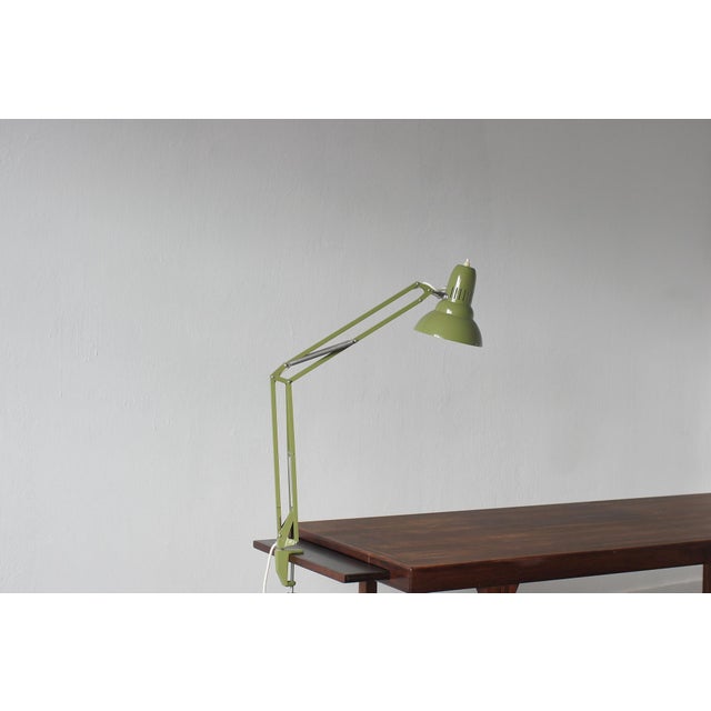 Minimalist form meets maximum functionality. The classic Ledu desk lamp in a deep olive shade is a nod to timeless design...