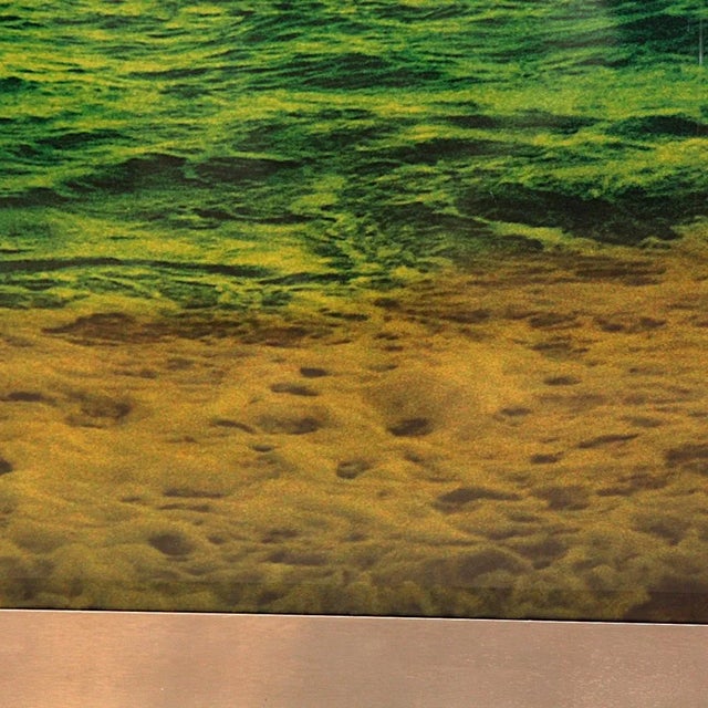 Capture the serenity of nature with this stunning Sunset Beach photograph, encased in a sleek brushed metal frame that...