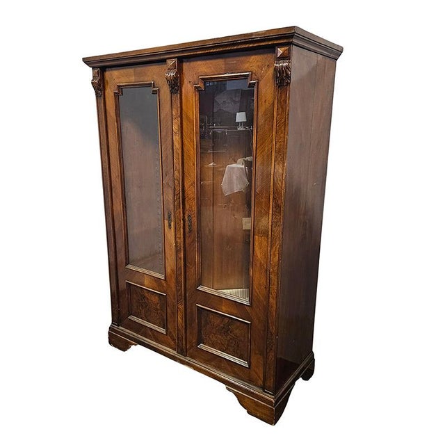 Walnut display cabinet with two doors and two useful shelves. 19th century. Dimensions (W x D x H): 128 x 52 x 178 cm