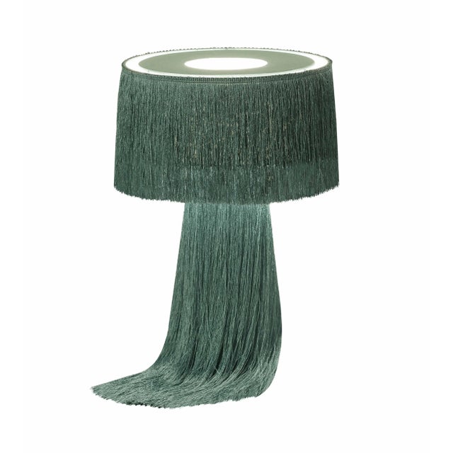 Draped with luxurious tassels, the Atolla collection will add warm lighting and textural elements to your space. Available...