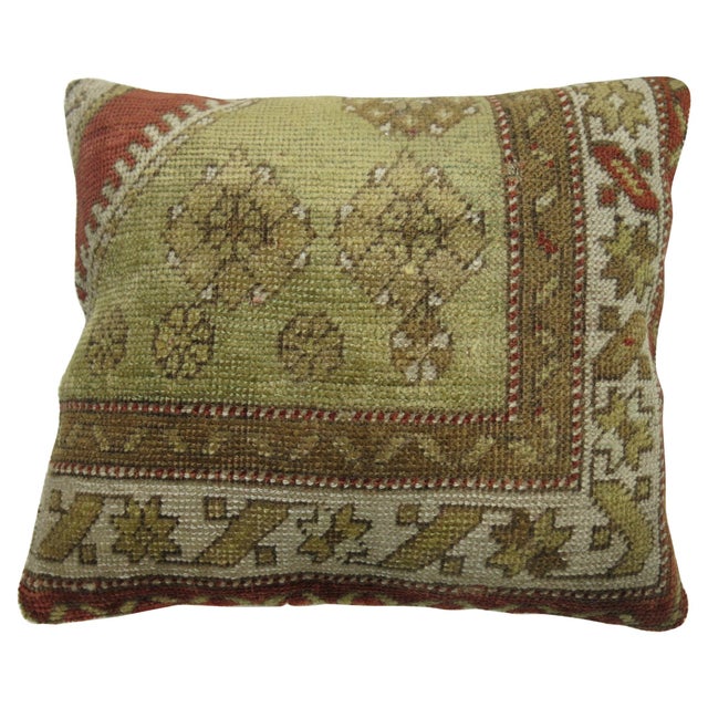 One-of-a-kind rug pillow made from a vintage Turkish Oushak with cotton back and zipper closure. Measures: 16'' x 18''.