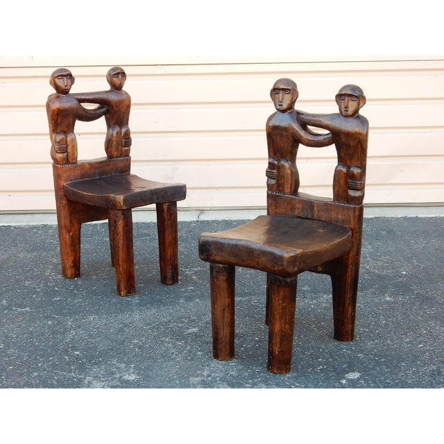 Pair of small, charming hand carved stools from Africa, circa early 1900's. Beautifully hand sculpted of a hardwood with a...
