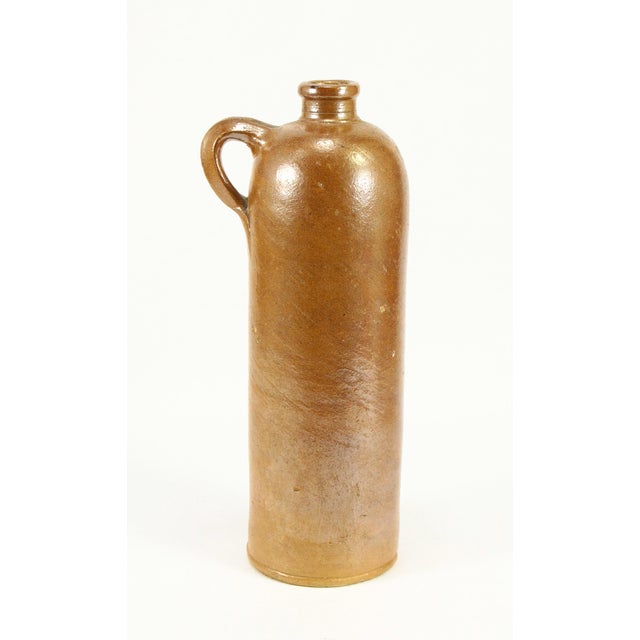 A very nice old mineral water bottle or seltzer jug from the late 1800's Salt glazed stoneware jug with applied handle,...