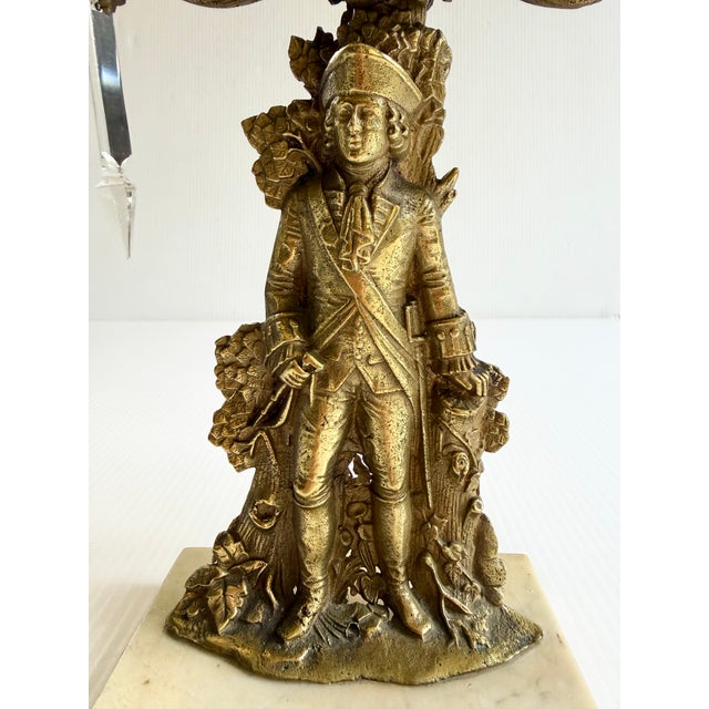 Ornate 3 arm Girandole with a marble and cast brass figural base featuring a soldier in uniform.