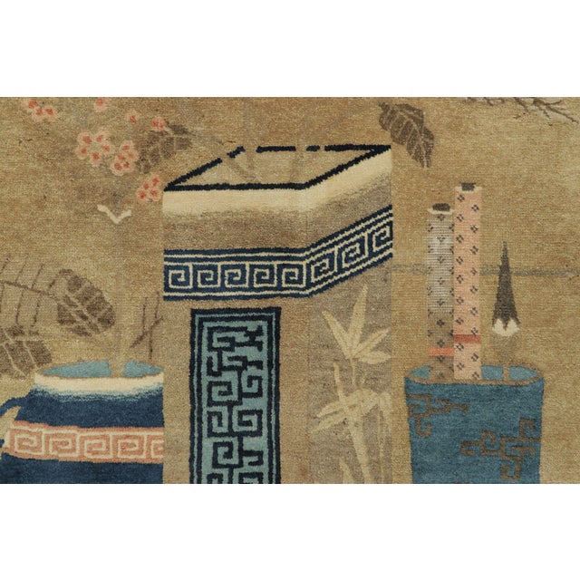 This antique 4x6 Chinese Peking rug, hand-knotted in wool circa 1900–1909, presents a refined pictorial layout centered on...