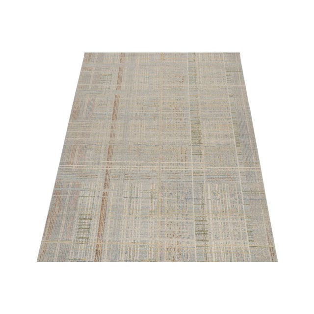 A 6x9 abstract rug, hand-knotted in distressed style wool from Rug & Kilim’s Homage Collection. Further on the Design:...