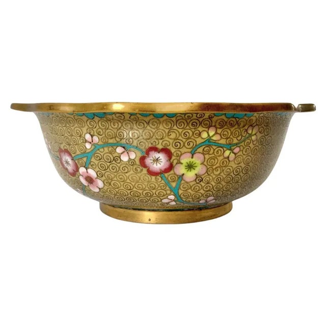 Vintage Chinese cloisonné bowl with scalloped edge. Background is a corn yellow with turquoise blue, cherry blossom...