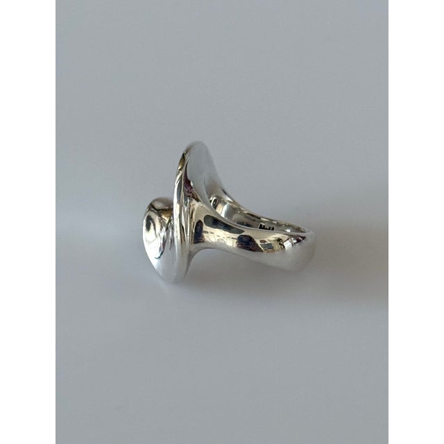 Solid 925 sterling silver ring by Georg Jensen, crafted in the Hans Hansen workshop in Denmark. The ring features a...