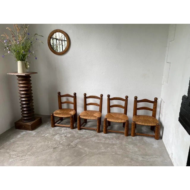 Nice set in beautiful vintage condition of these low oak chairs and straw seats styled after Charles Dudouyt. dimensions:...