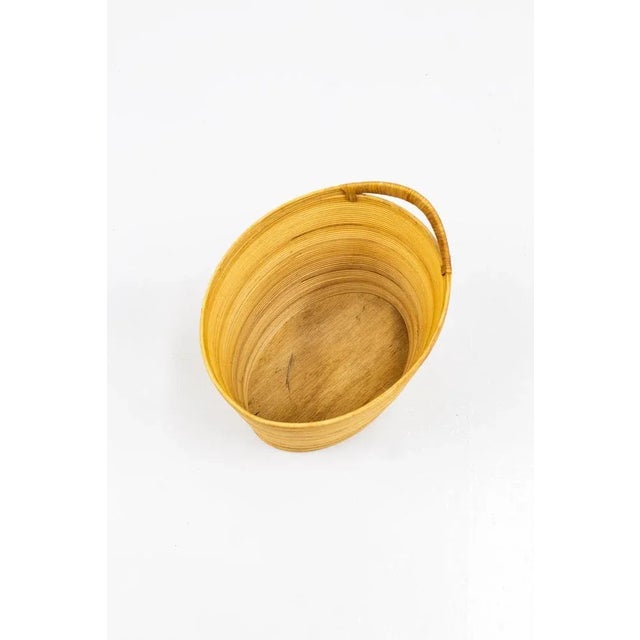 Papper basket designed and manufactured by Laurids Lønnborg in denmark. Made during the 1950s. Made from rattan and hand...