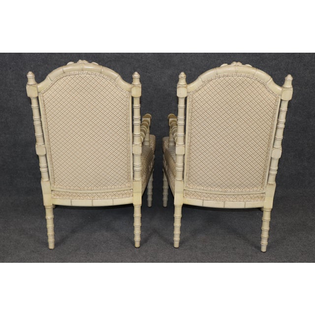 Add timeless European charm to your home with this stunning pair of French inspired faux bamboo armchairs. Beautifully...