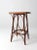 This antique Adirondack style twig table is crafted with willow for an elegant look. Its slender slat top is accented with...