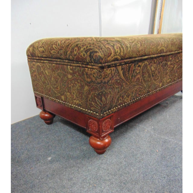 Regency style ottoman , cherry base with bun feet , paisley print fabric , top lifts for storage inside
