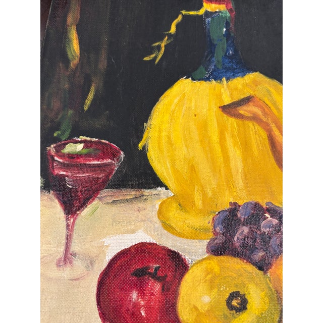 This original vintage still life oil painting signed by the artist features a richly colored tabletop arrangement with...