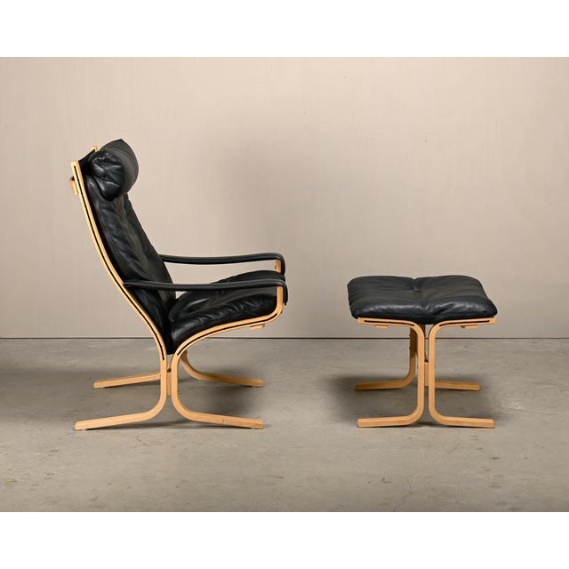 Ingmar Relling Siesta armchair and footstool for Rybo / Westnofa, Norway. Frame of natural oak with a strong canvas...