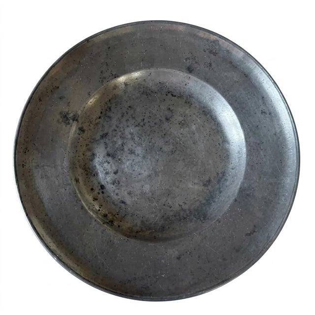 This item is a remarkable 18th-century European pewter deep charger (serving platter), displaying highly distinctive owner...