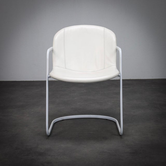 A refined set of four dining chairs designed by gastone rinaldi for thema in the 1970s. The design reflects rinaldi’s...