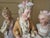 A charming and finely modeled antique Meissen porcelain figural group depicting a gallant gentleman accompanied by two...