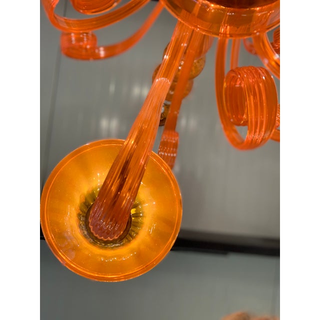 Contemporary Translucent orange Murano Glass Chandelier in Deco’ Style Decorated in translucent orange colour which makes...