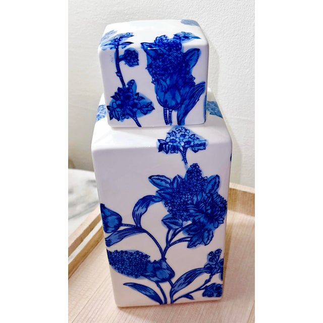 Vintage Blue and White Porcelain Square Jar with Lid – Floral Motif A striking square porcelain jar with matching lid,...