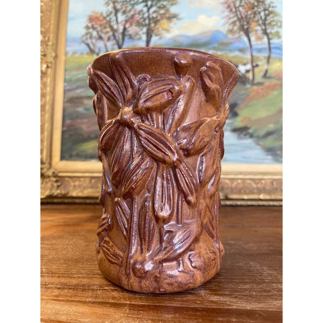 Vintage Red Wing Pottery vase featuring a deeply sculpted floral relief pattern in a warm brown glaze. The raised...