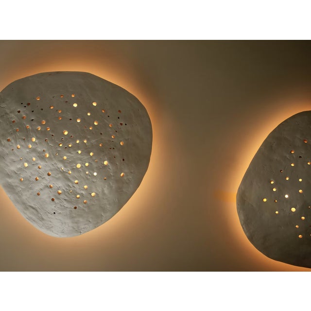 "Inspired by oyster and scallop shells, the Oyster Pendant explores the juxtaposition between raw material and beauty....