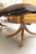 This is an elegant twin-pedestal dining table crafted in richly figured mahogany with a beautifully book-matched top...