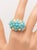 This stunning turquoise dome ring expertly crafted in 18K yellow gold with a cluster of cabochon Persian turquoises set in...